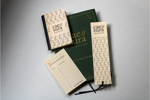 cae//sura menu, business card/bookmark, mini composition book, and punch card